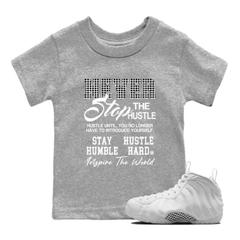 Never Stop The Hustle baby and kids t-shirt crafted for little sneakerheads to shine with the Air Foamposite One Triple White sneakers, displayed in Heather Grey 1.