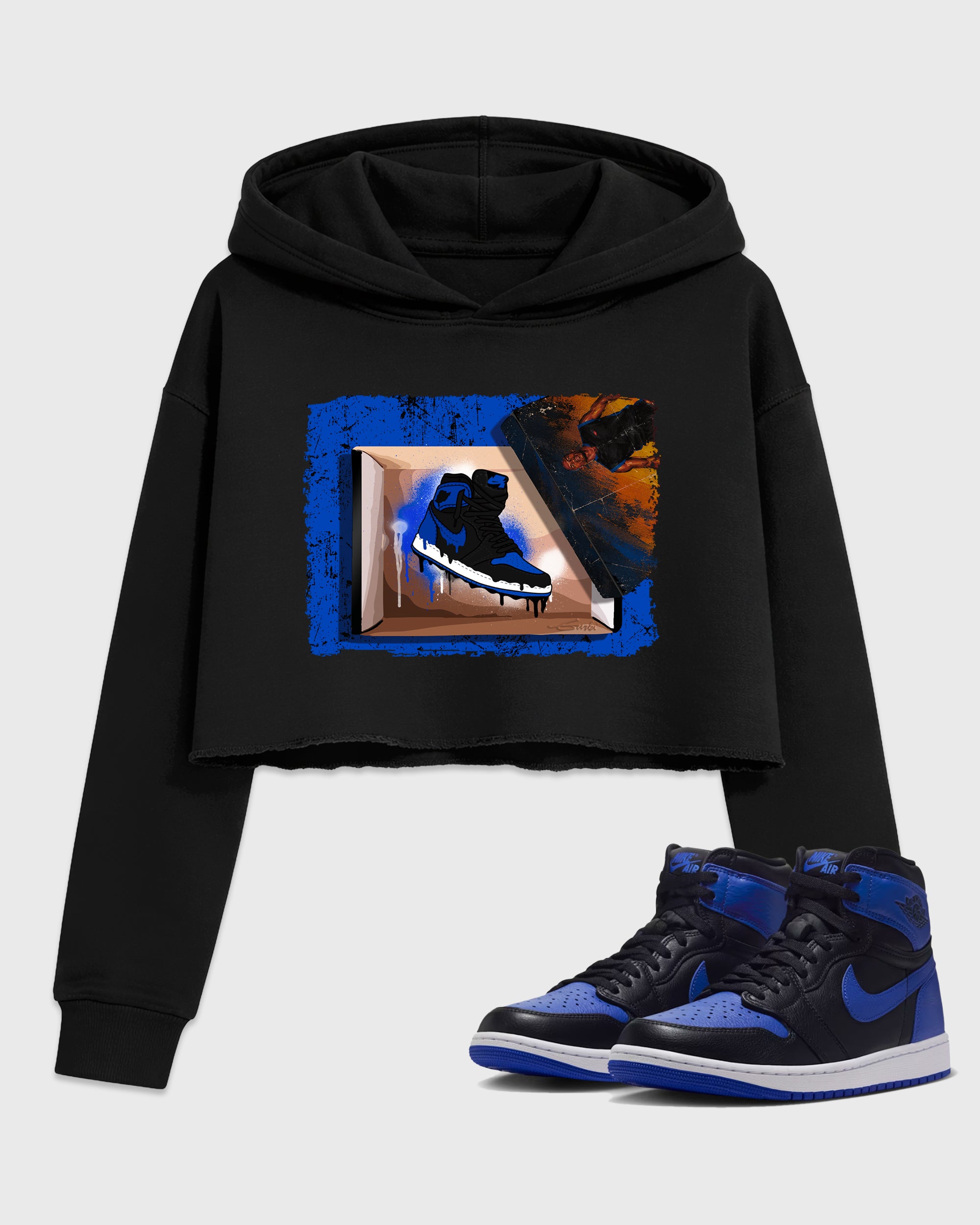 New Kicks Women’s Graphic Crop Tee featuring original streetwear artwork designed to match the Air Jordan 1 Royal. Black 1 Crop Tee.