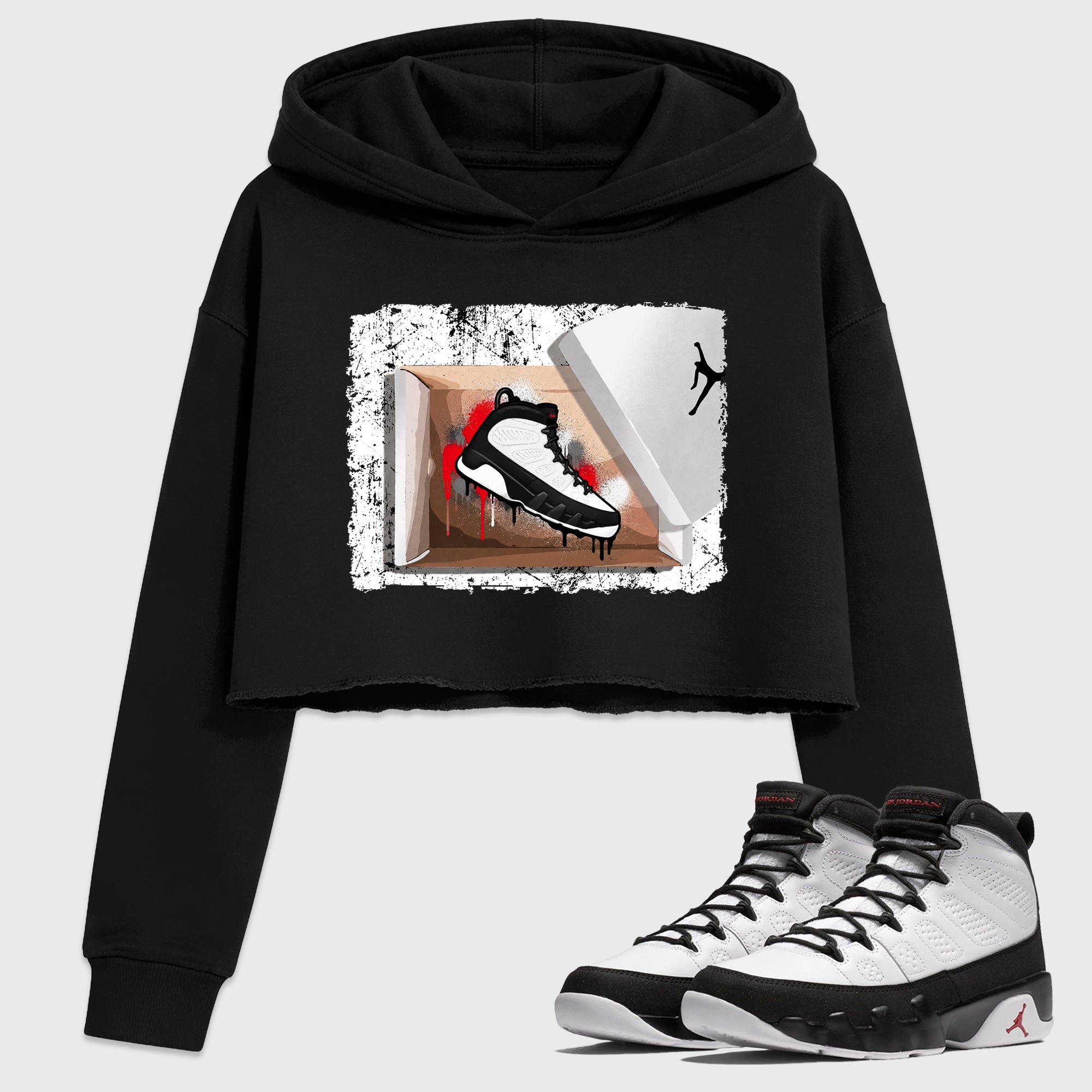 New Kicks Women’s Graphic Crop Tee featuring original streetwear artwork designed to match the Air Jordan 9 True Red. Black 1 Crop Tee.