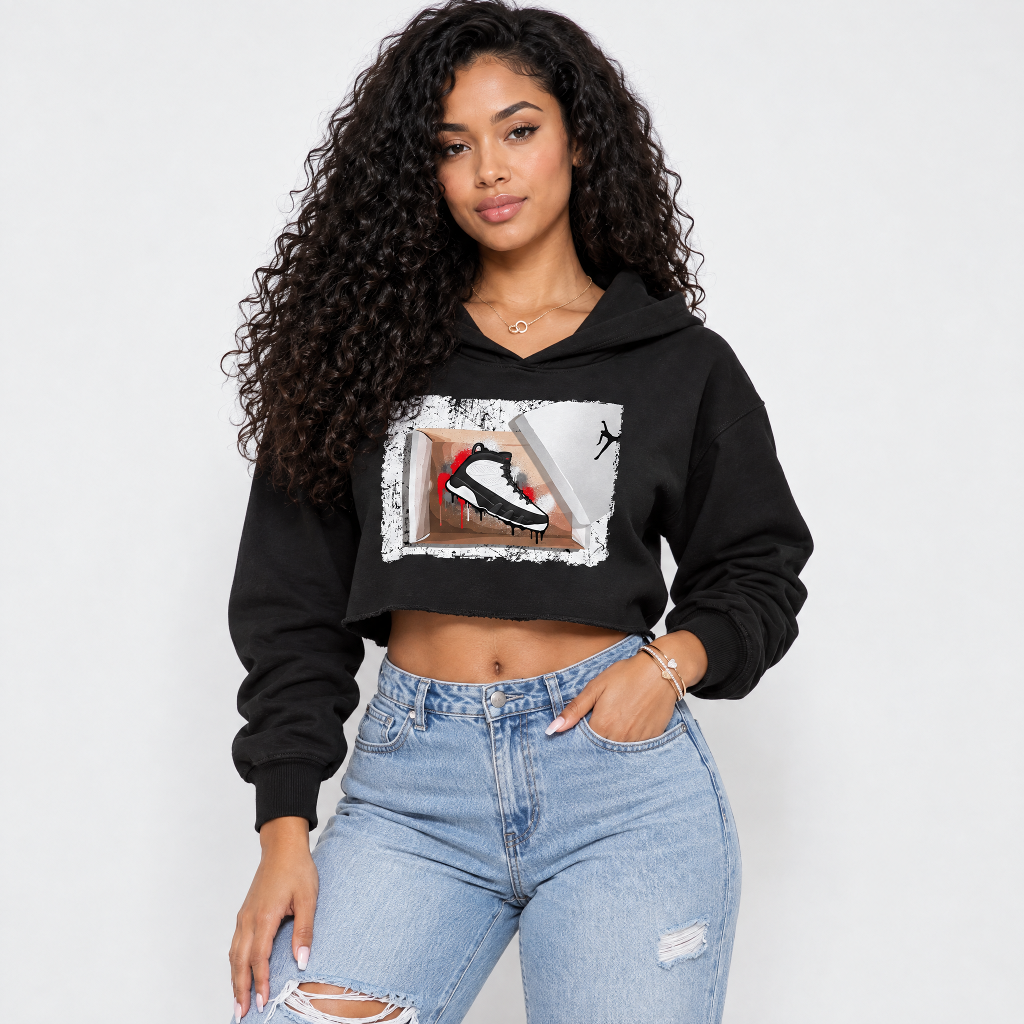 New Kicks Women’s Graphic Crop Tee featuring original streetwear artwork designed to match the Air Jordan 9 True Red. Black 1 Crop Tee.