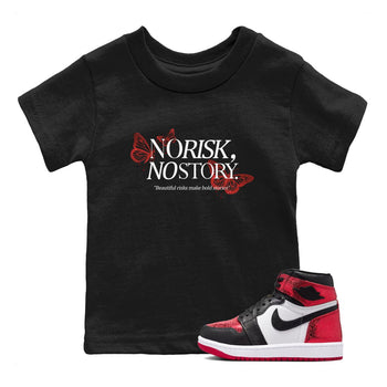 No Risk No Story baby and kids t-shirt crafted for little sneakerheads to shine with the Air Jordan 1 Ruby sneakers, displayed in Black 1.