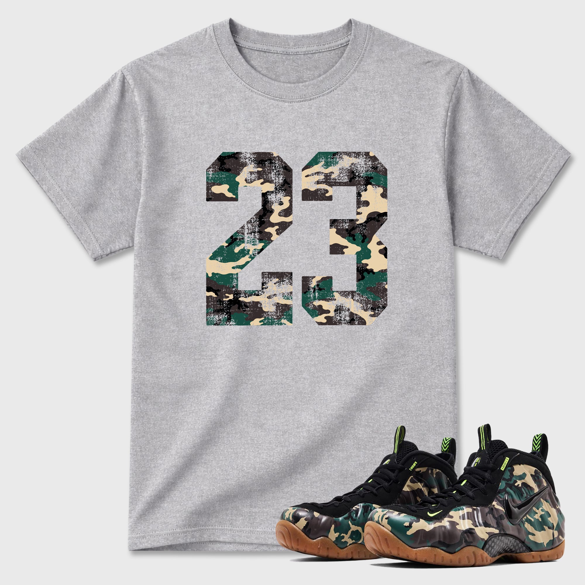 No.23 Graphic T-Shirt featuring original streetwear artwork designed to match the Air Foamposite Pro Green Camo. Heather Grey 1 Graphic T-Shirt.