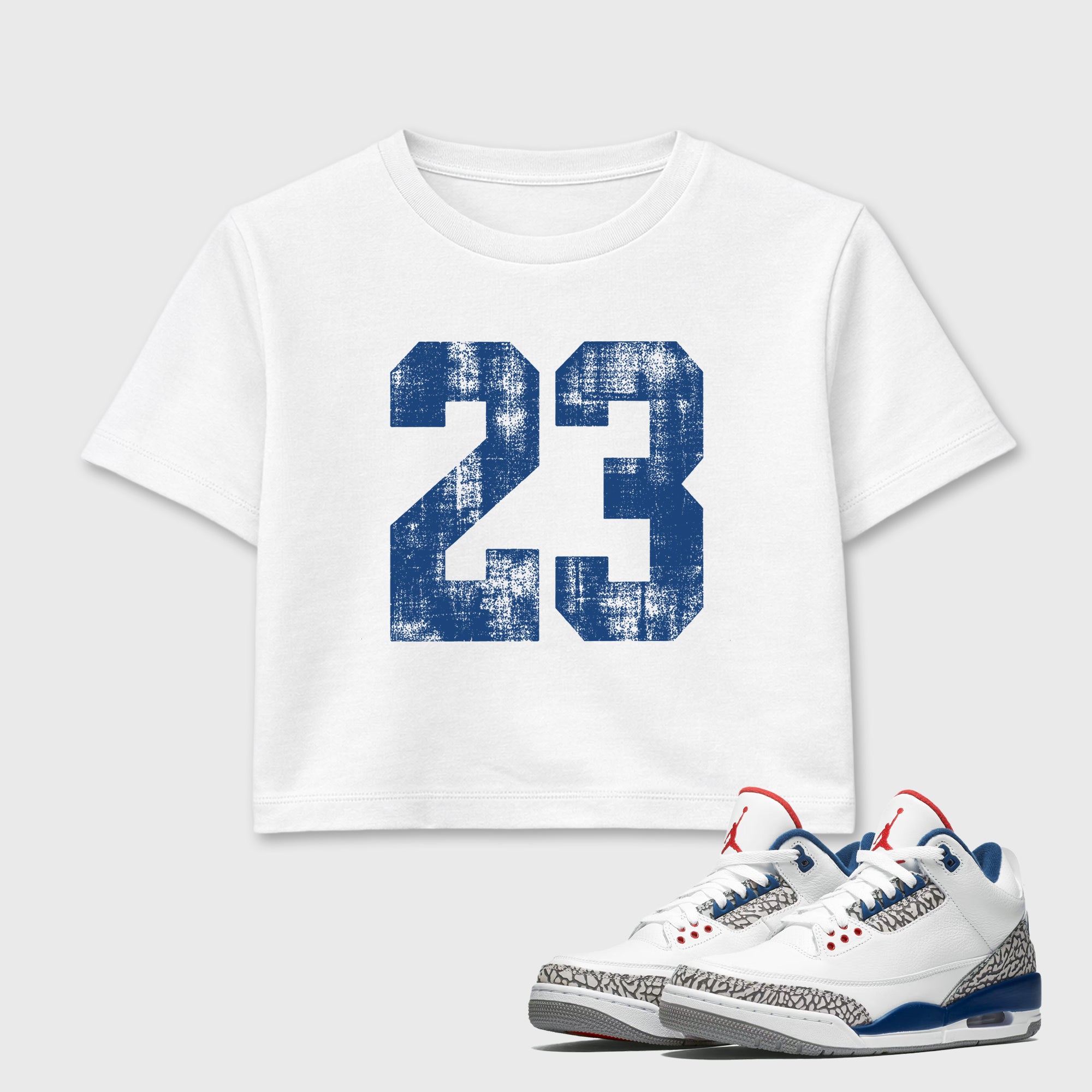 No.23 women’s crop tee designed to match the Air Jordan 3 True Blue, featuring coordinated White 1 options for a perfect streetwear vibe.