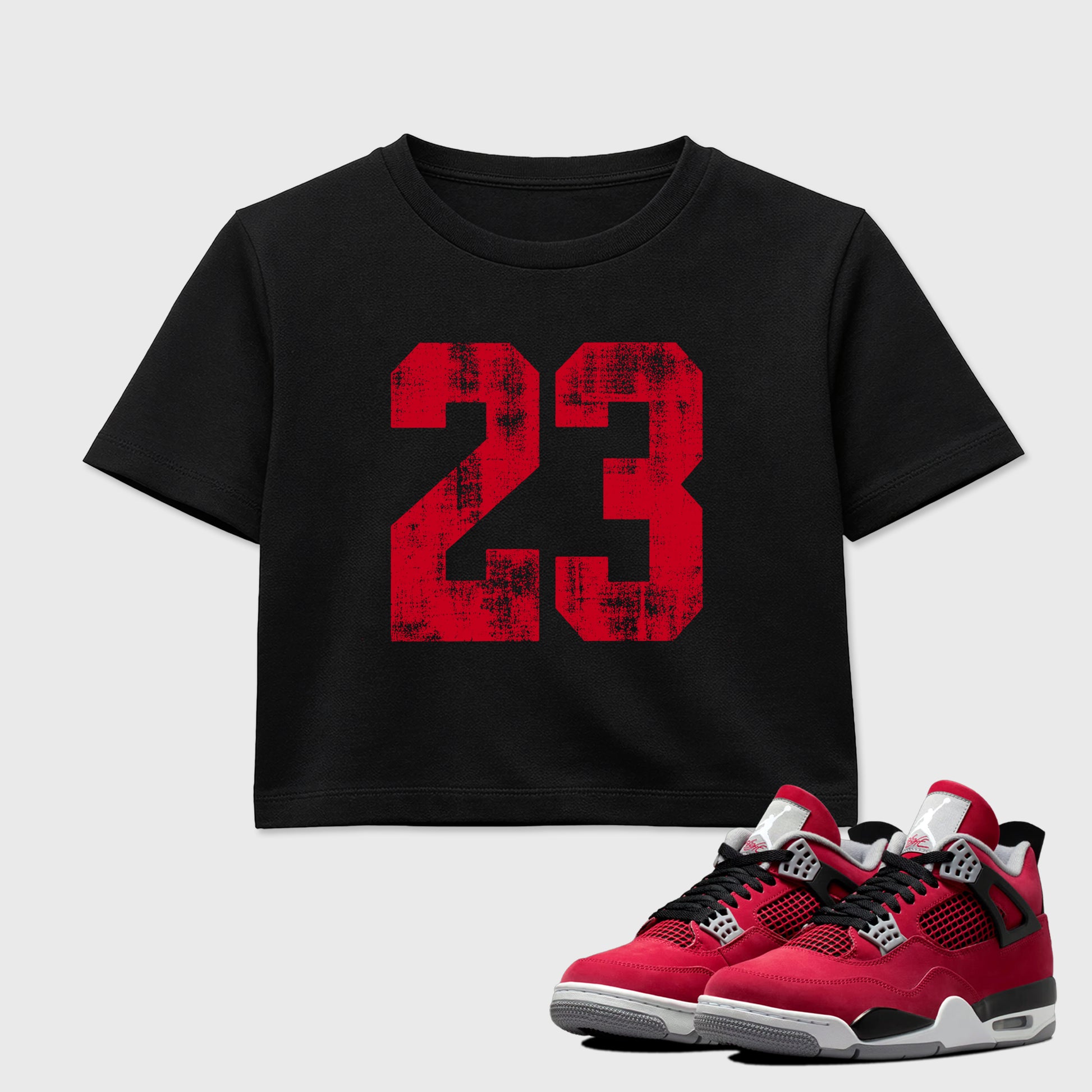 No.23 women’s crop tee designed to match the Air Jordan 4 Toro Bravo, featuring coordinated Black 1 options for a perfect streetwear vibe.