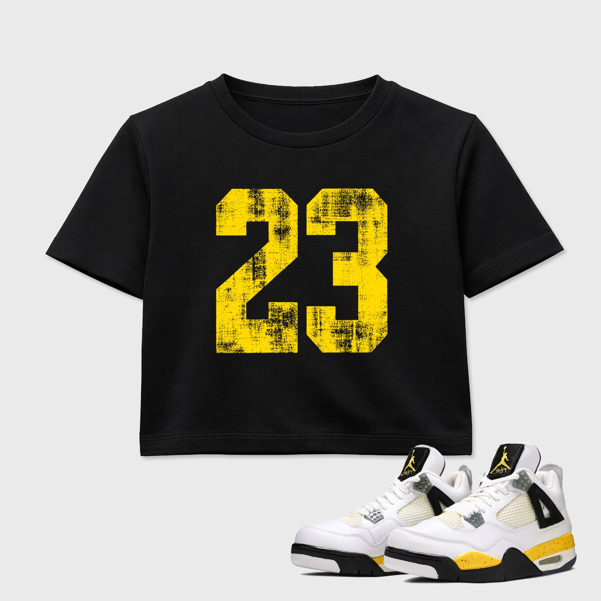 No.23 women’s crop tee designed to match the Air Jordan 4 Tour Yellow, featuring coordinated Black 1 options for a perfect streetwear vibe.