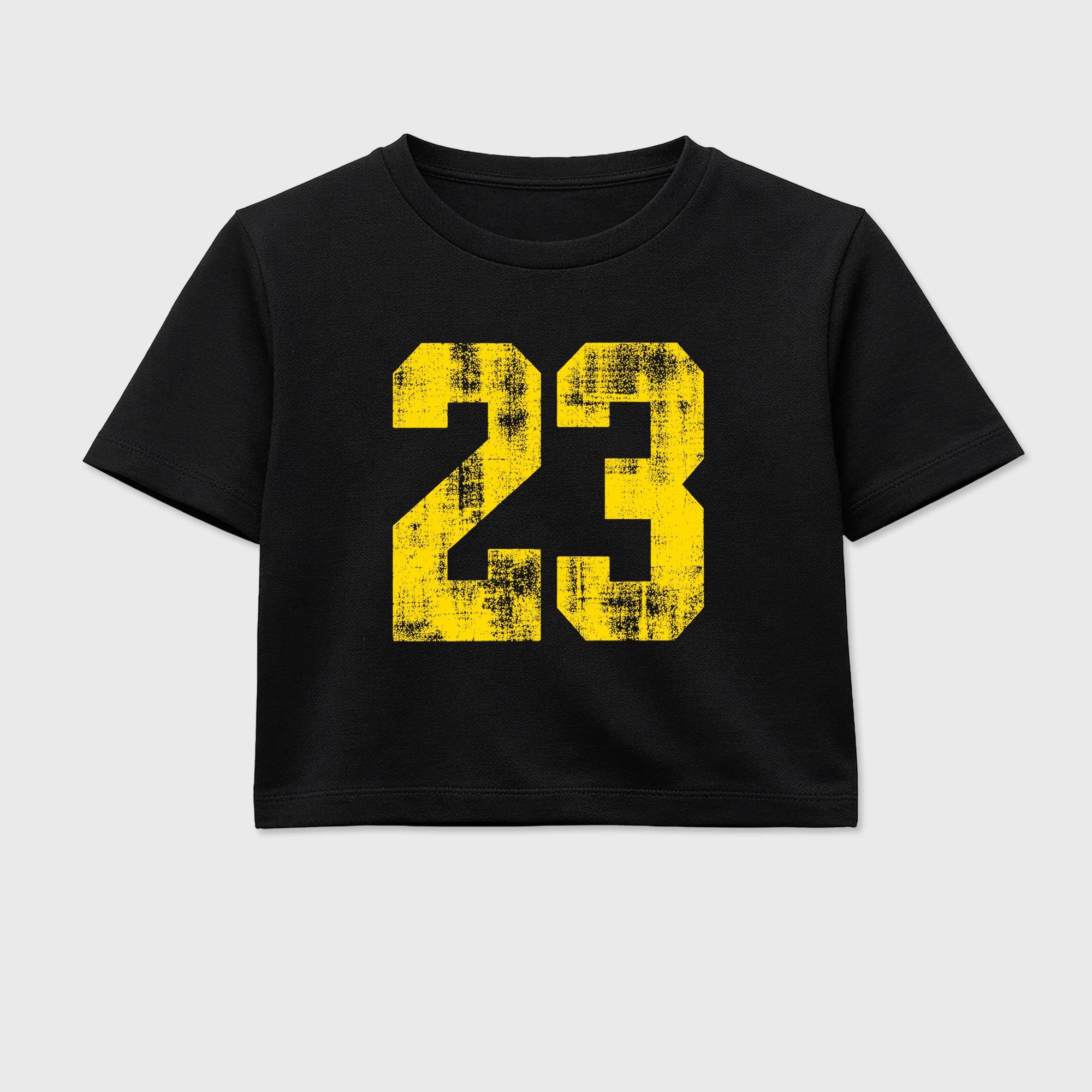 No.23 women’s crop tee designed to match the Air Jordan 4 Tour Yellow, featuring coordinated Black 2 options for a perfect streetwear vibe.