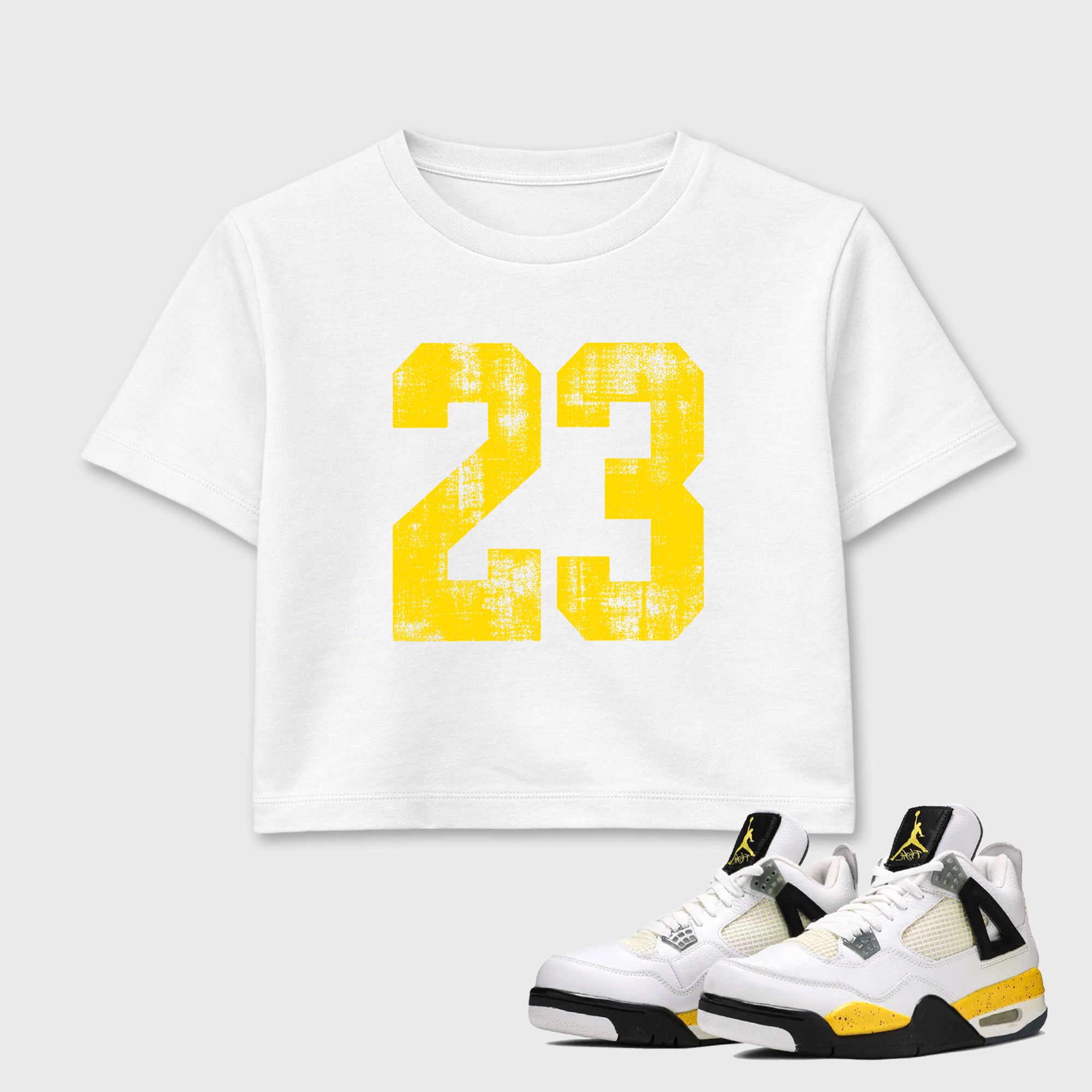 No.23 women’s crop tee designed to match the Air Jordan 4 Tour Yellow, featuring coordinated White 1 options for a perfect streetwear vibe.