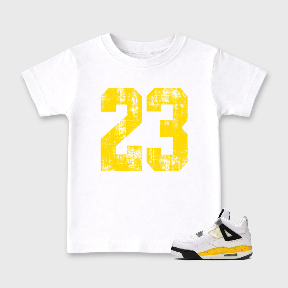 No.23 Baby & Kids Graphic T-Shirt featuring original artwork designed to match the Air Jordan 4 Tour Yellow. White 1 Kids Graphic Tee.