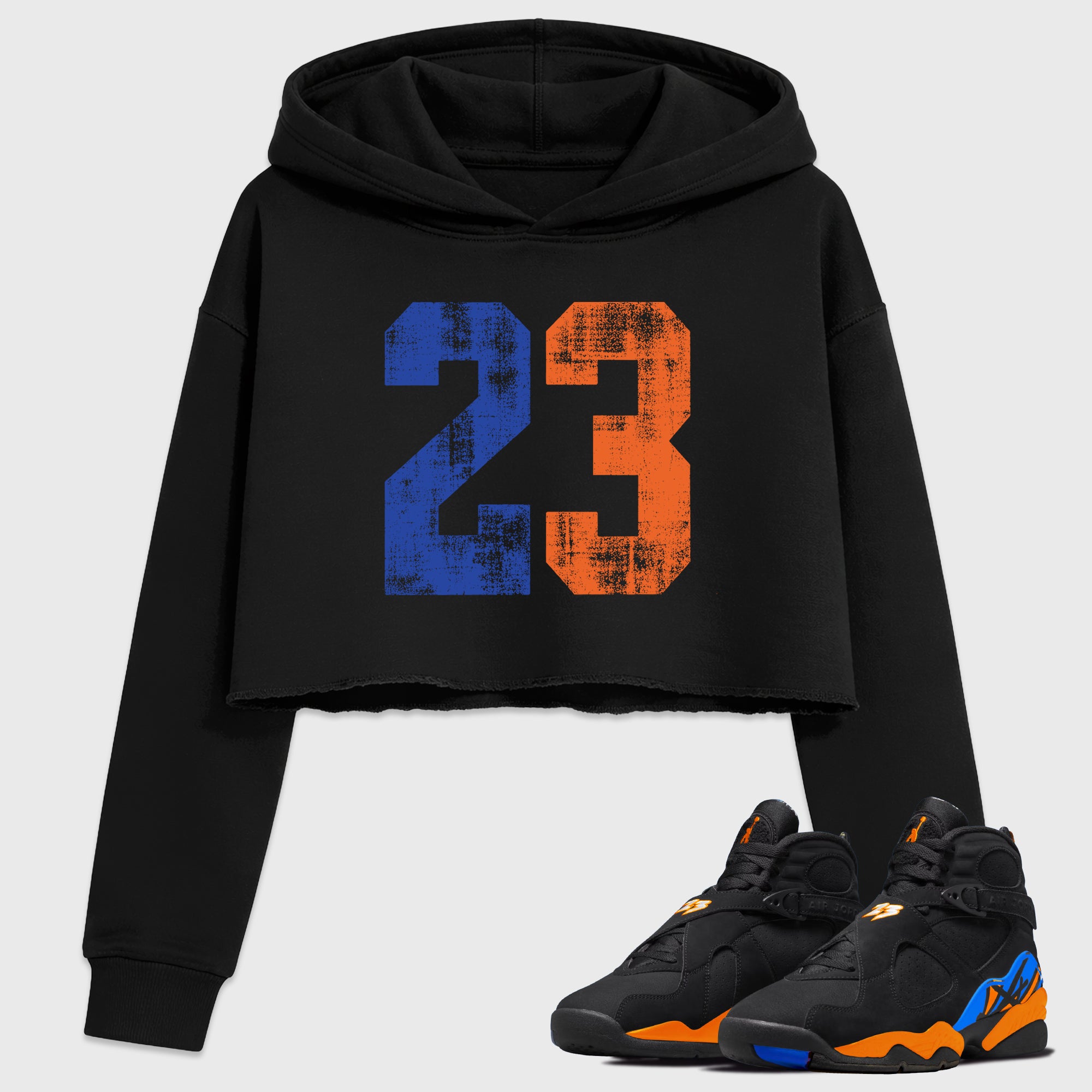 No.23 Women’s Graphic Crop Tee featuring original streetwear artwork designed to match the Air Jordan 8 Knicks. Black 1 Crop Tee.