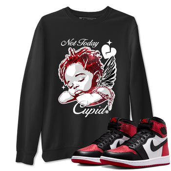 Not Today Cupid sneaker match t-shirt styled to complete your fit with the Air Jordan 1 Ruby sneakers, shown in Black 1.