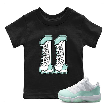 Number 11 baby and kids t-shirt crafted for little sneakerheads to shine with the Air Jordan 11 Igloo sneakers, displayed in Black 1.