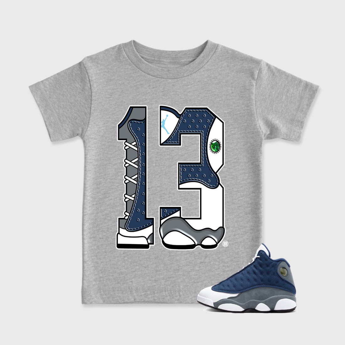 Number 13 Baby & Kids Graphic T-Shirt featuring original artwork designed to match the Air Jordan 13 Flint. Heather Grey 1 Kids Graphic Tee.