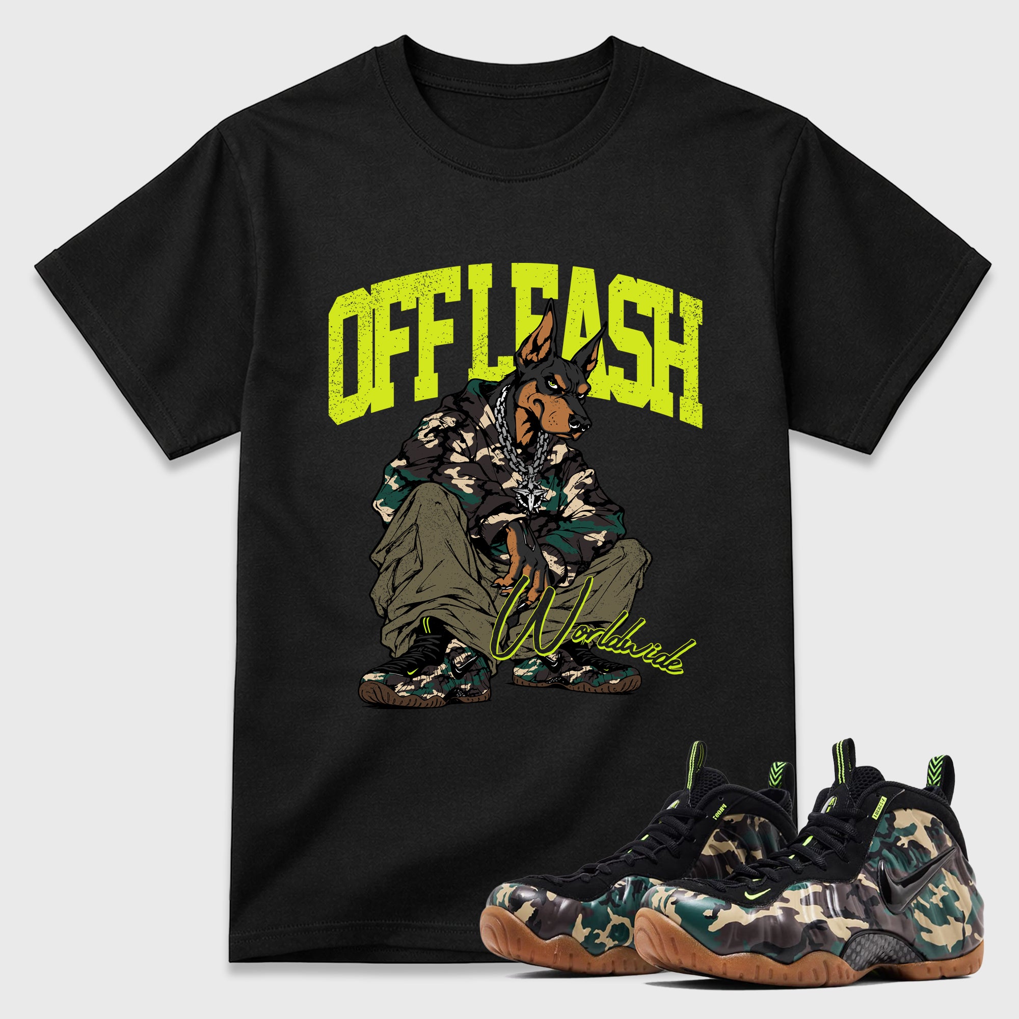 Off Leash Graphic T-Shirt featuring original streetwear artwork designed to match the Air Foamposite Pro Green Camo. Black 1 Graphic T-Shirt.