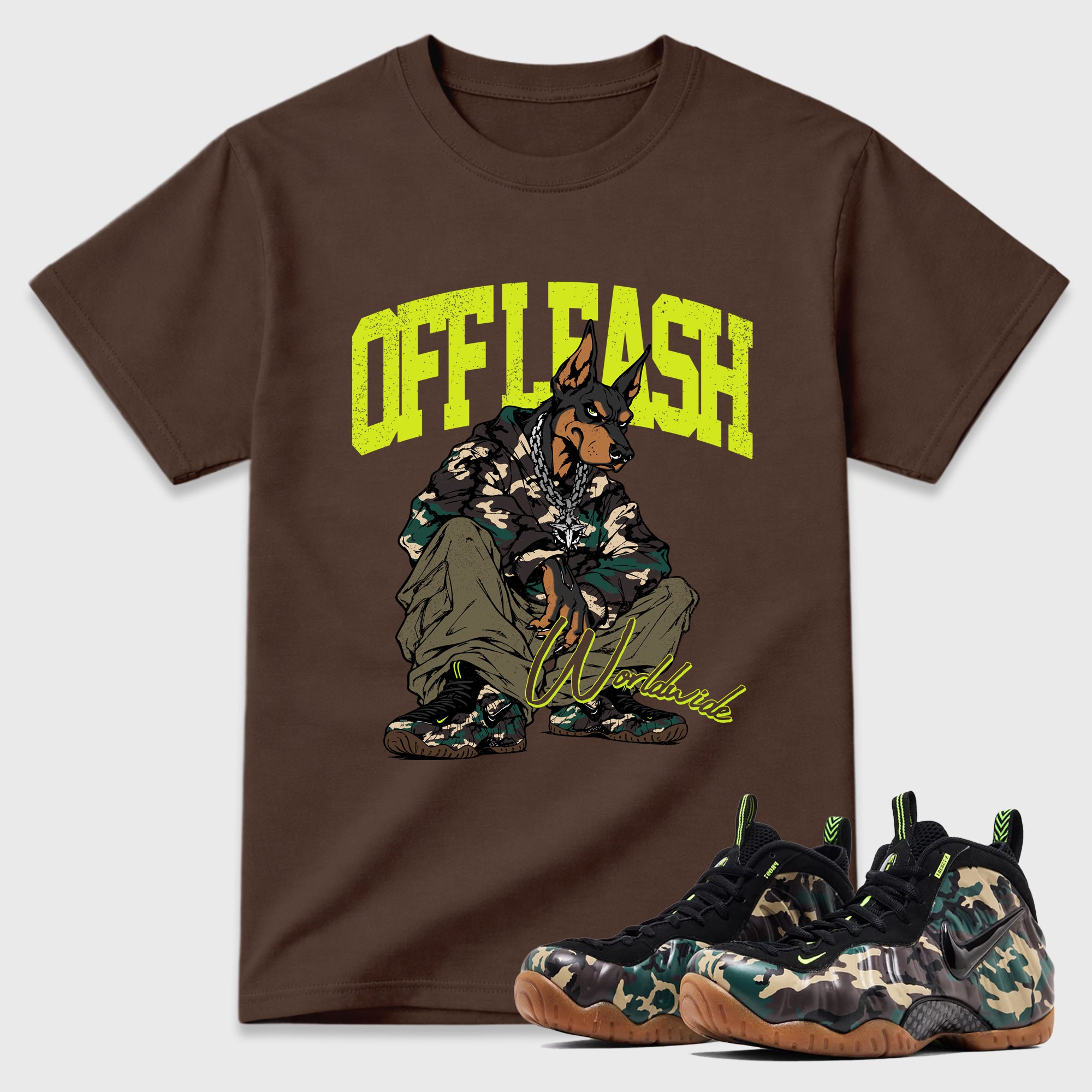 Off Leash Graphic T-Shirt featuring original streetwear artwork designed to match the Air Foamposite Pro Green Camo. Dark Chocolate 1 Graphic T-Shirt.