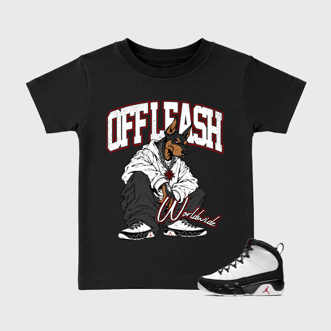 Off Leash Baby & Kids Graphic T-Shirt featuring original artwork designed to match the Air Jordan 9 True Red. Black 1 Kids Graphic Tee.