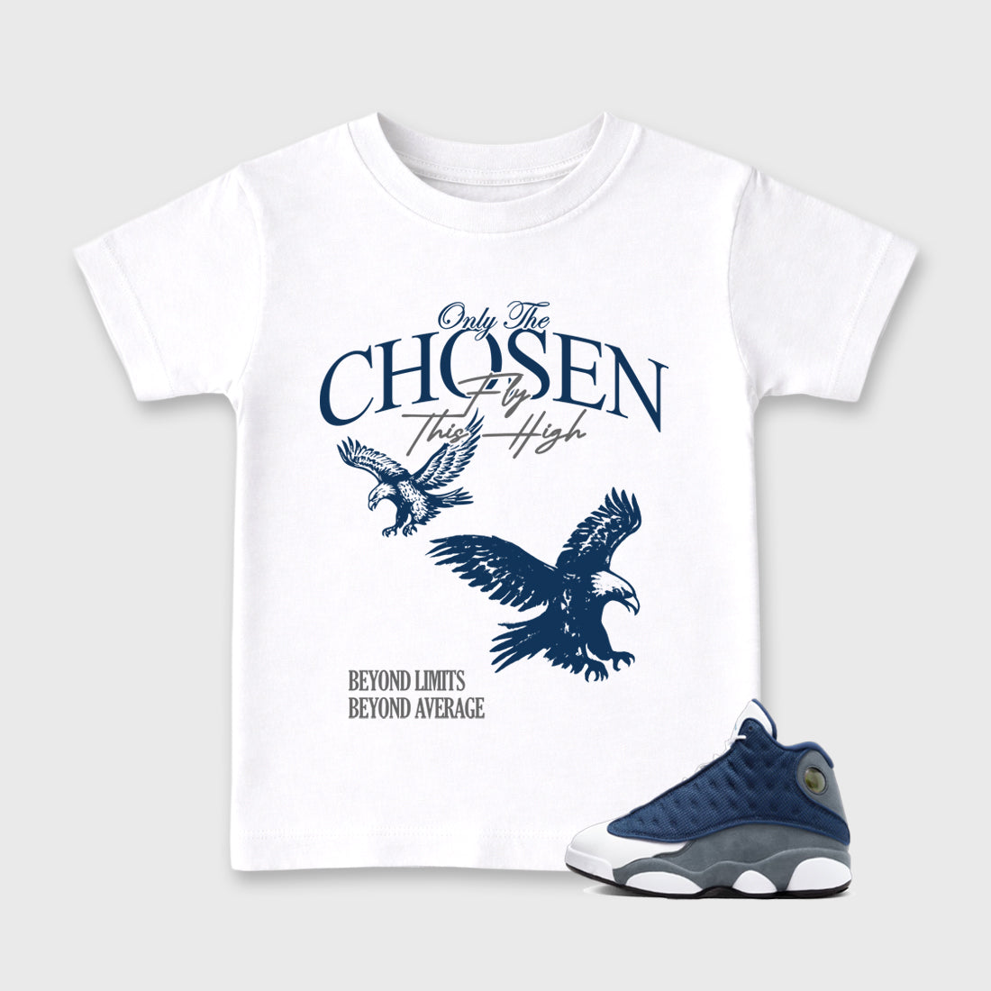 Only The Chosen Fly This High Baby & Kids Graphic T-Shirt featuring original artwork designed to match the Air Jordan 13 Flint. White 1 Kids Graphic Tee.