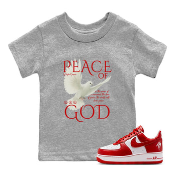 Peace of God baby and kids t-shirt crafted for little sneakerheads to shine with the Air Force 1 University Red sneakers, displayed in Heather Grey 1.