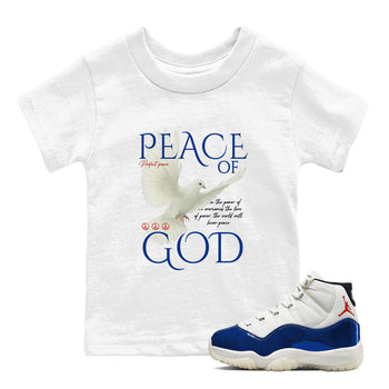 White t-shirt with 'Peace of God' text and dove graphic, paired with a white and blue sneaker.
