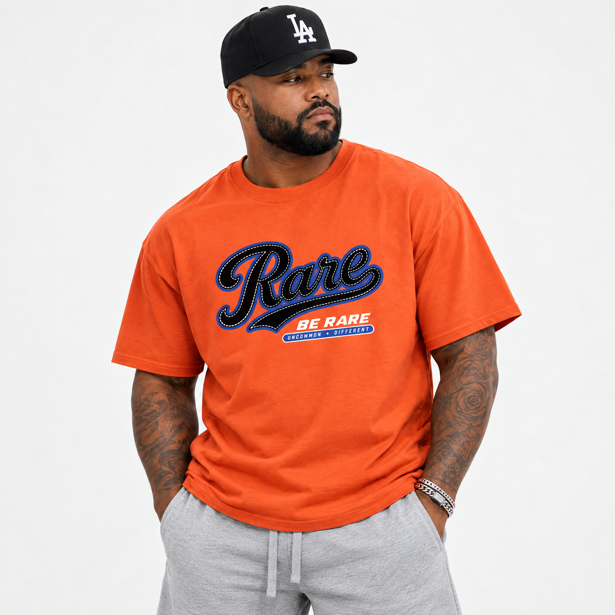 Rare Graphic T-Shirt featuring original streetwear artwork designed to match the Air Jordan 8 Knicks. Orange 1 Graphic T-Shirt.