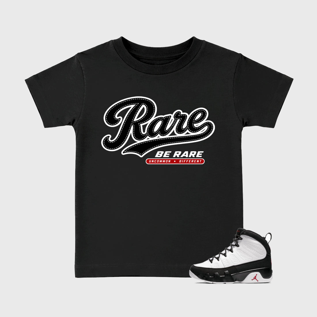 Rare Baby & Kids Graphic T-Shirt featuring original artwork designed to match the Air Jordan 9 True Red. Black 1 Kids Graphic Tee.