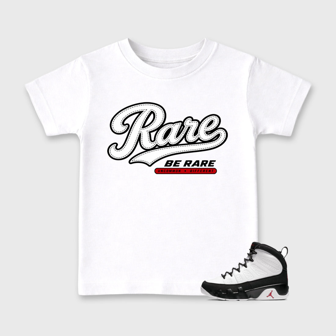 Rare Baby & Kids Graphic T-Shirt featuring original artwork designed to match the Air Jordan 9 True Red. White 1 Kids Graphic Tee.