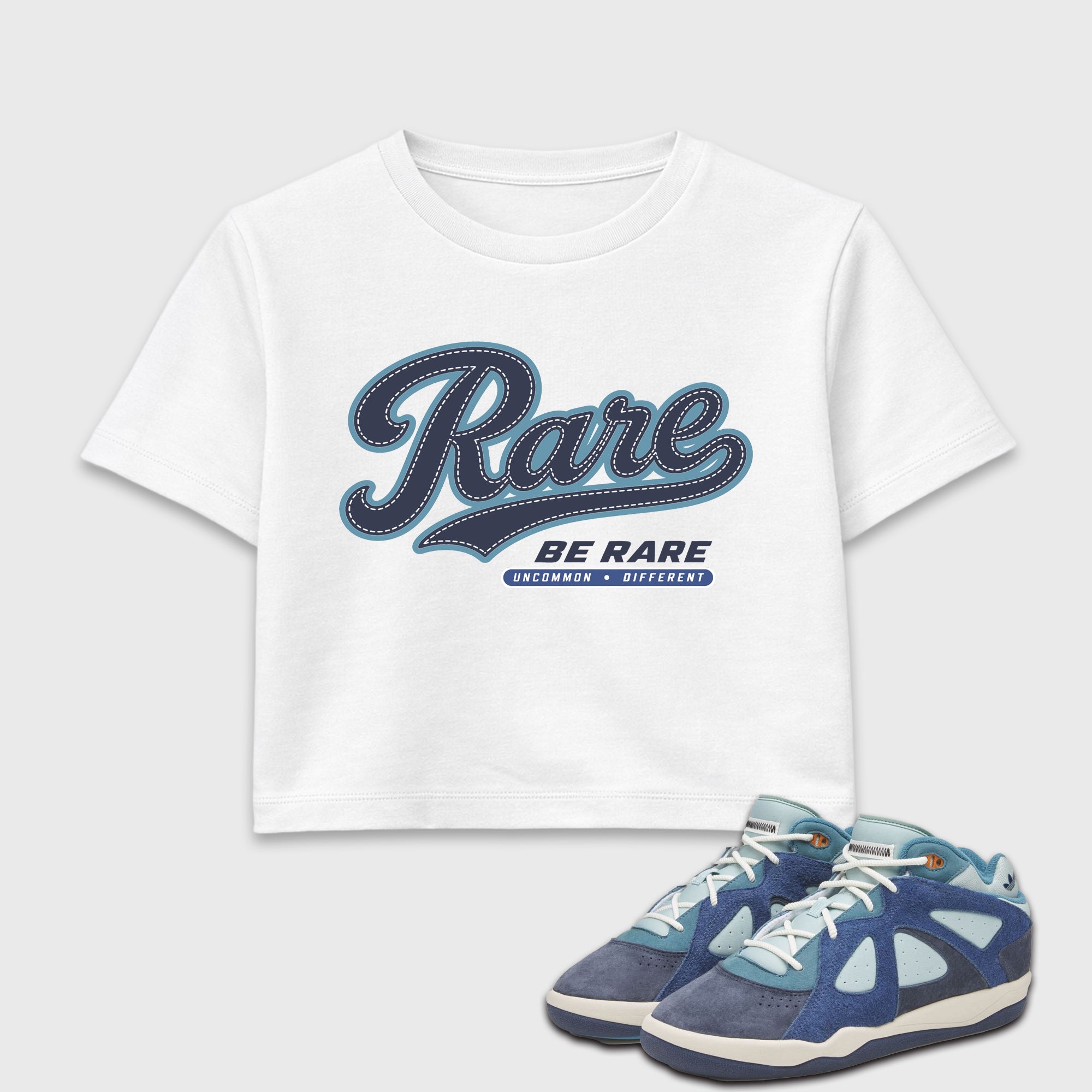 Rare women’s crop tee designed to match the Badbo 1.0 Night Navy, featuring coordinated White 1 options for a perfect streetwear vibe.