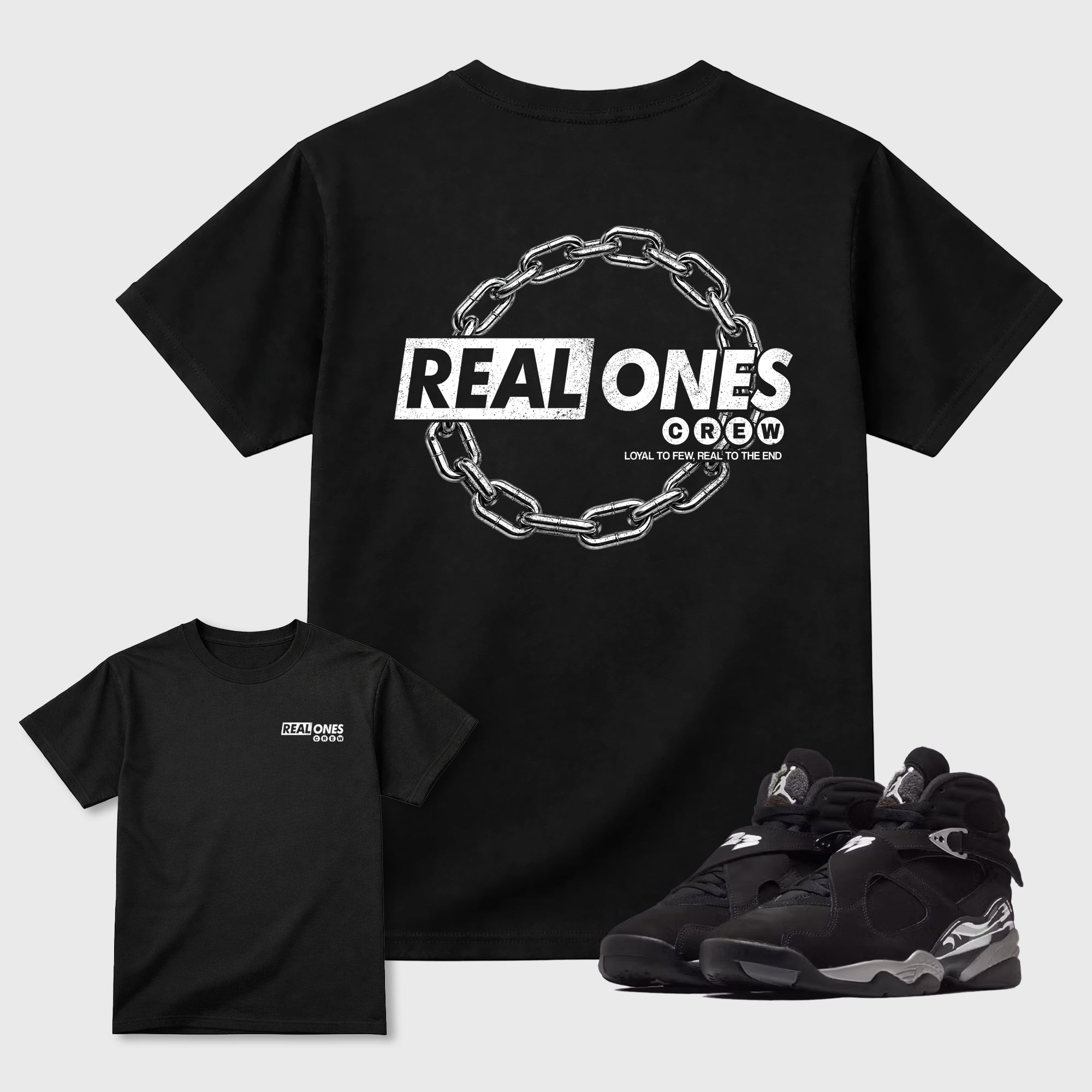 Real Ones Crew Graphic T-Shirt featuring original streetwear artwork designed to complement the black, graphite, and silver-grey tones of the Jordan 8 Chrome. Black Graphic T-Shirt.