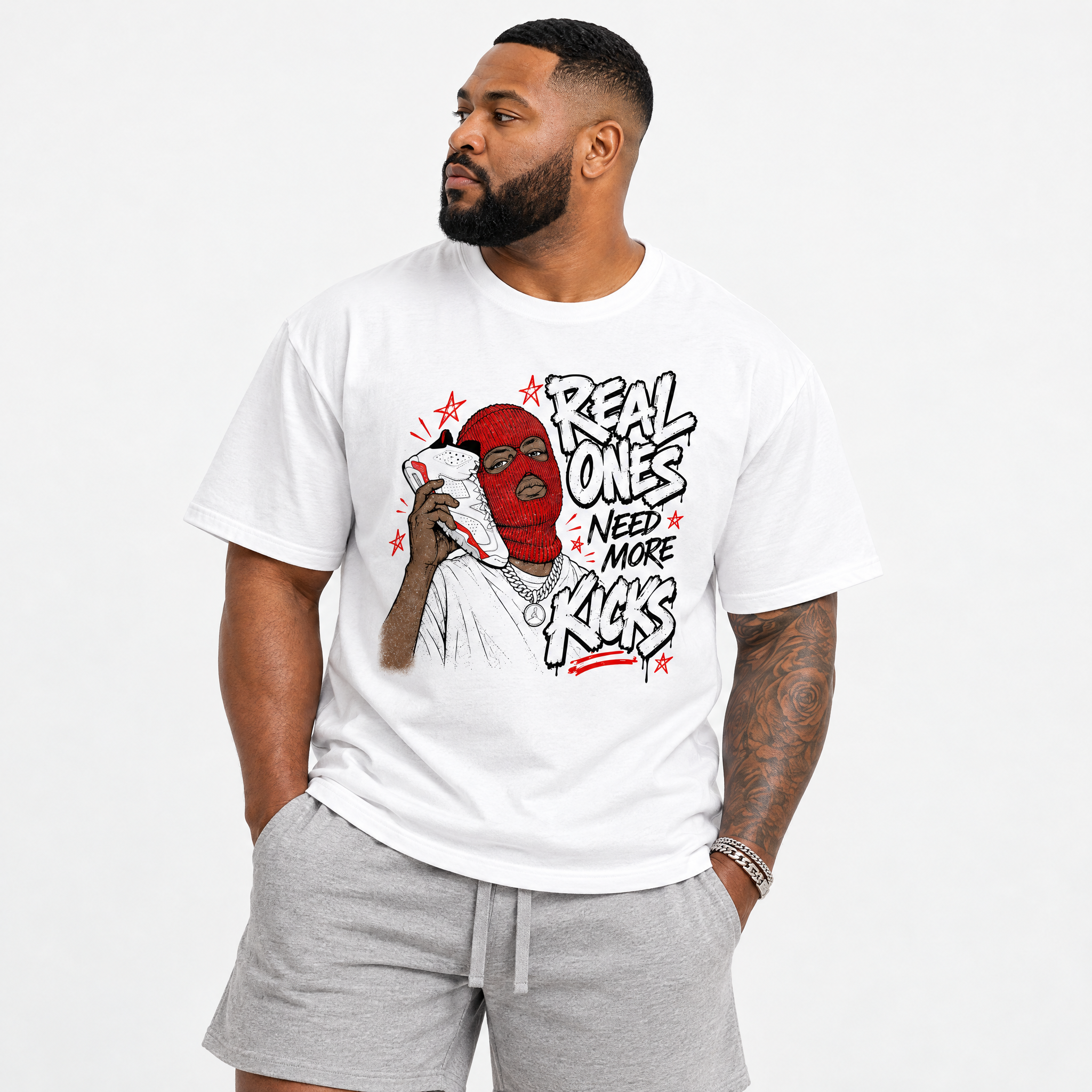 Real Ones Need More Kicks Graphic T-Shirt featuring original streetwear artwork designed to match the Air Jordan 6 White Infrared. White 1 Graphic T-Shirt.
