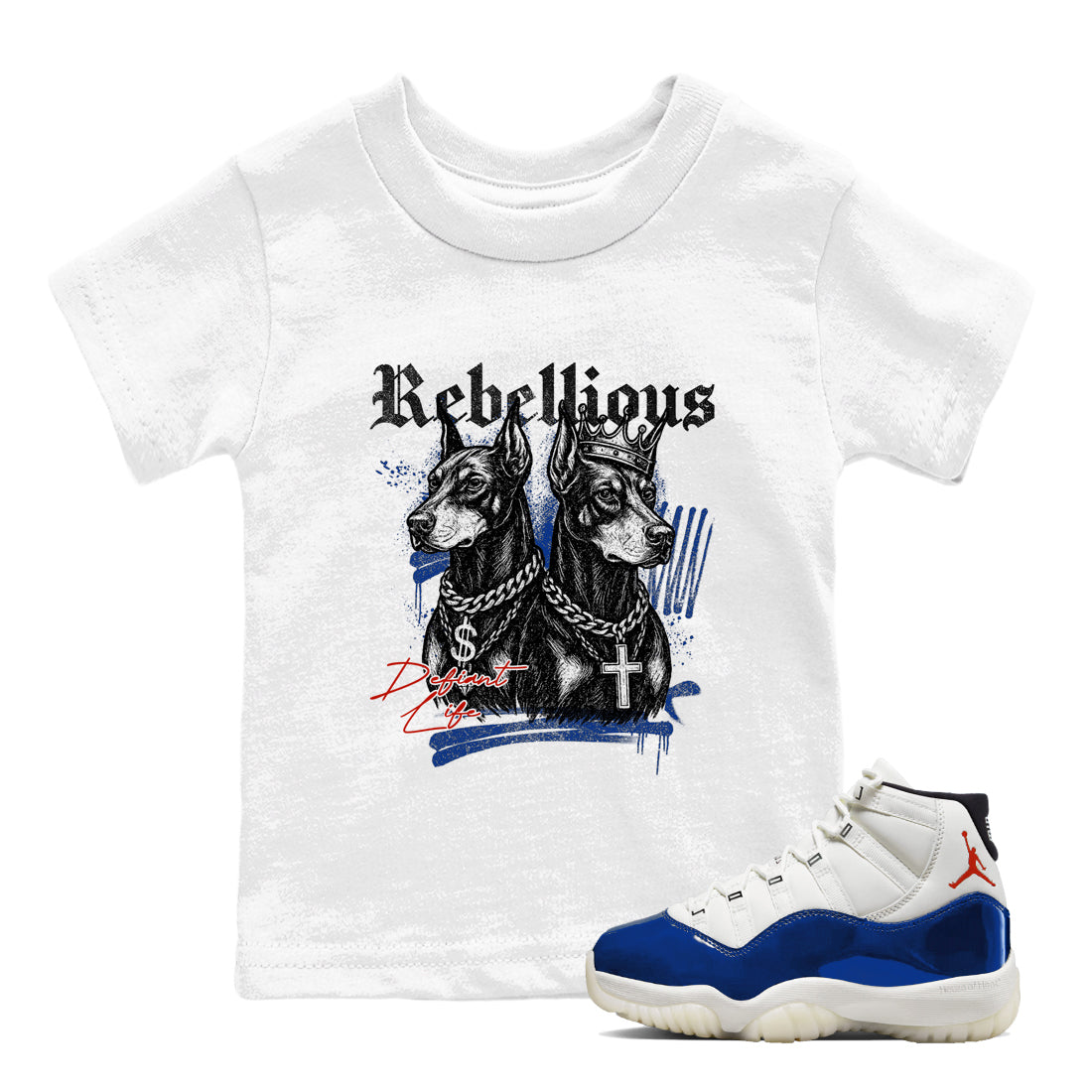 White t-shirt with graphic design of two dogs and text 'Rebellious' next to a blue and white sneaker.