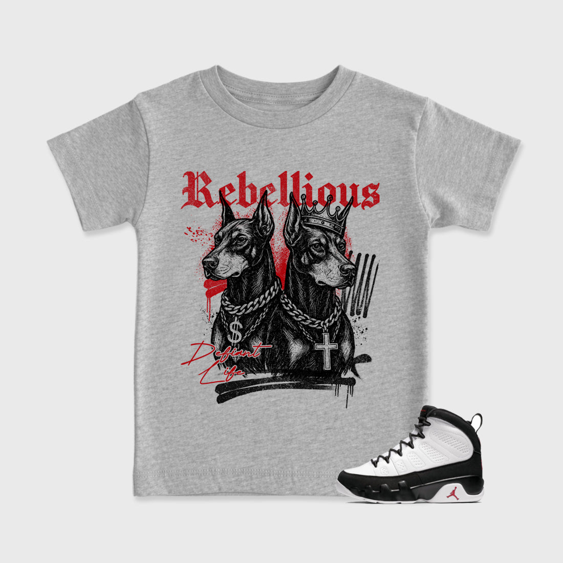 Rebellious Baby & Kids Graphic T-Shirt featuring original artwork designed to match the Air Jordan 9 True Red. Heather Grey 1 Kids Graphic Tee.