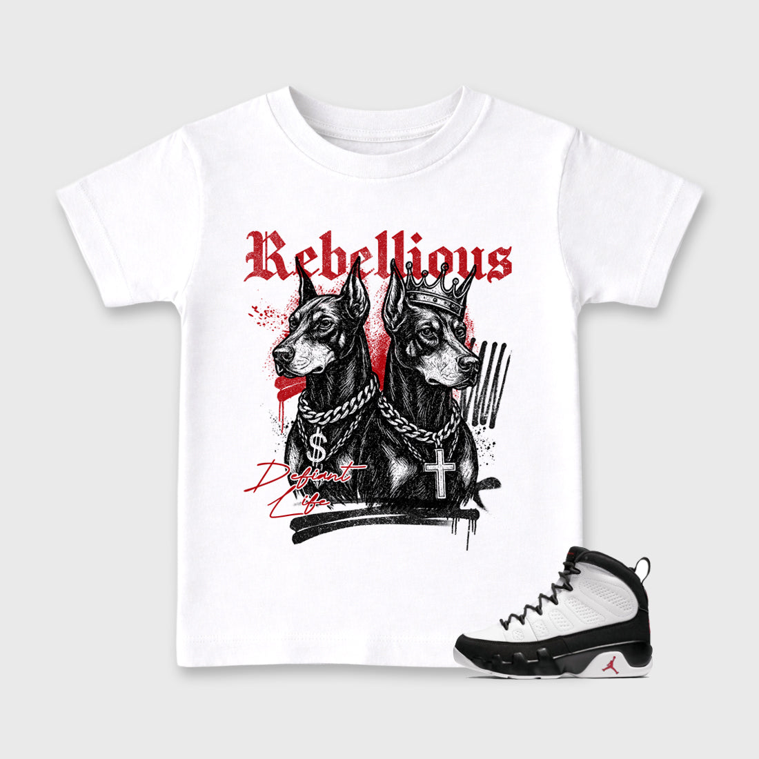 Rebellious Baby & Kids Graphic T-Shirt featuring original artwork designed to match the Air Jordan 9 True Red. White 1 Kids Graphic Tee.