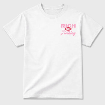 Rich Or Nothing graphic t-shirt styled to complete your sneaker outfit with the Air Jordan 1 Low x Travis Scott Tropical Pink, shown in White.