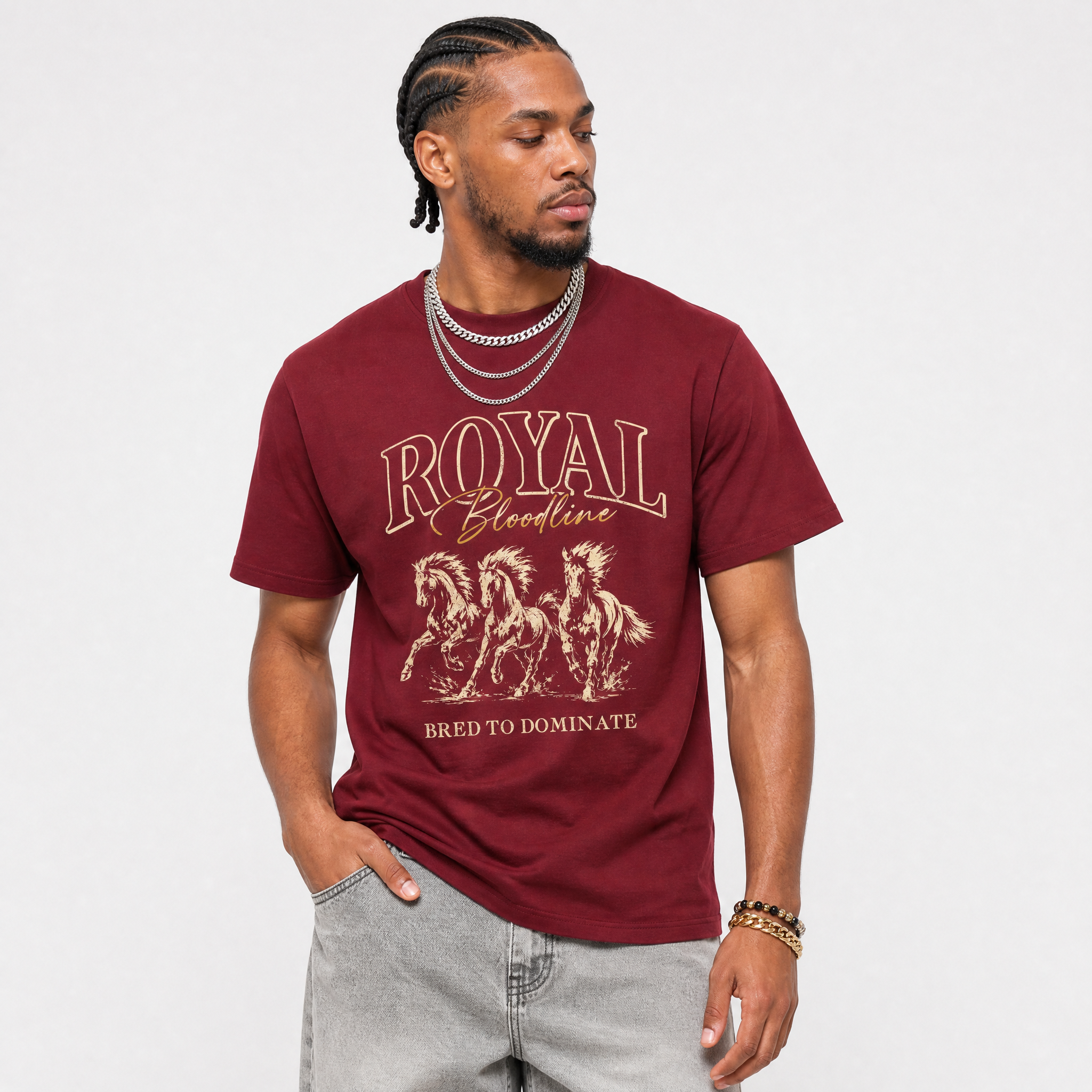 Man wearing a maroon t-shirt with horse graphic and text on a plain background