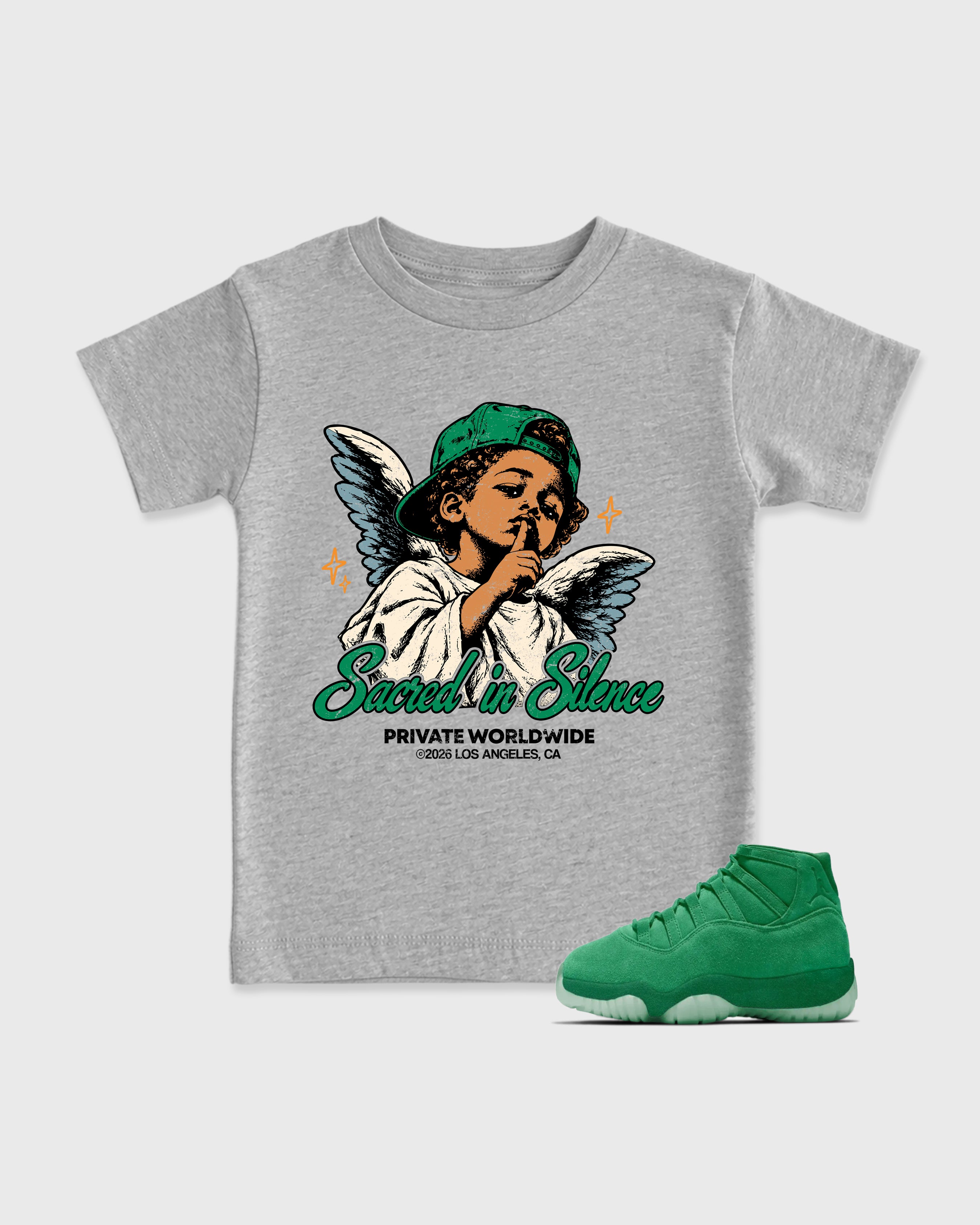 Sacred In Silence Baby & Kids Graphic T-Shirt featuring original artwork designed to match the Air Jordan 11 Green Screen. Heather Grey 1 Kids Graphic Tee.