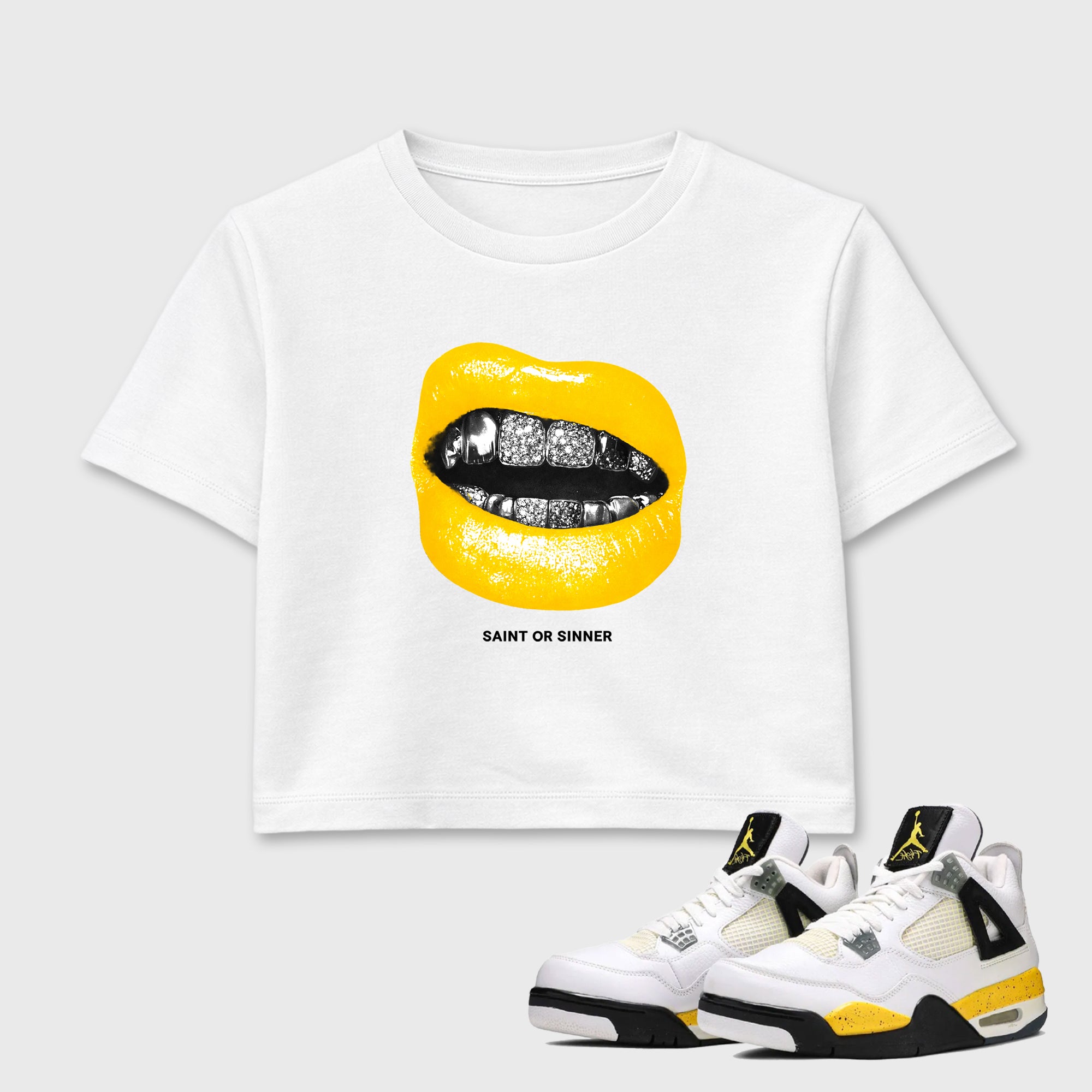 Saint or Sinner women’s crop tee designed to match the Air Jordan 4 Tour Yellow, featuring coordinated White 1 options for a perfect streetwear vibe.