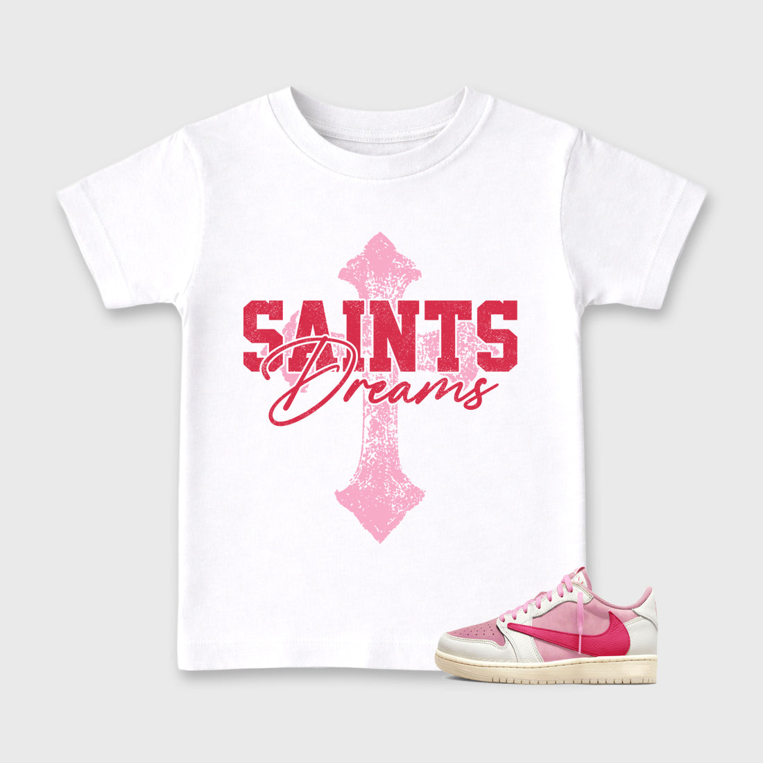 Saints Dreams affordable baby and kids t-shirt designed to match the Air Jordan 1 Travis Scott Tropical Pink, featuring coordinated White 1 options for the perfect little sneakerhead streetwear look.