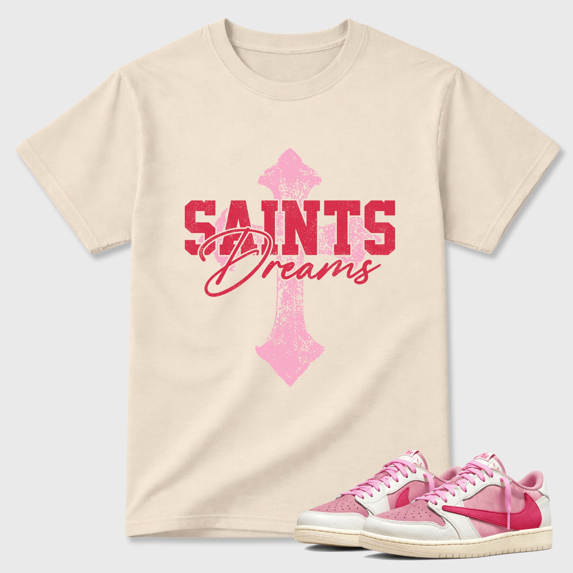 Saints Dreams Graphic T-Shirt sneaker match tee designed for the Air Jordan 1 Travis Scott Tropical Pink, featuring coordinated color options for a perfect streetwear match. Natural 1 shirt.