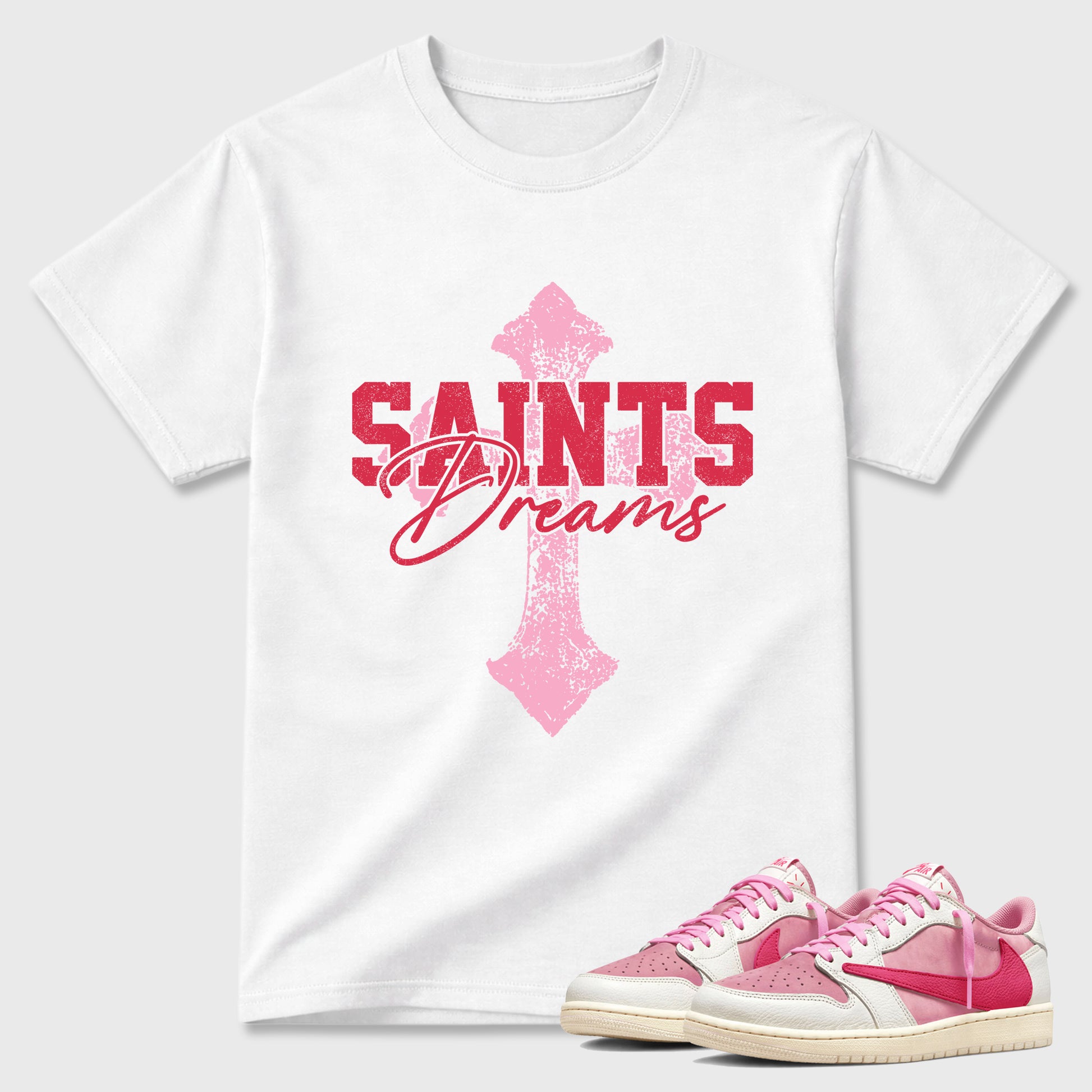 Saints Dreams Graphic T-Shirt sneaker match tee designed for the Air Jordan 1 Travis Scott Tropical Pink, featuring coordinated color options for a perfect streetwear match. White 1 shirt.