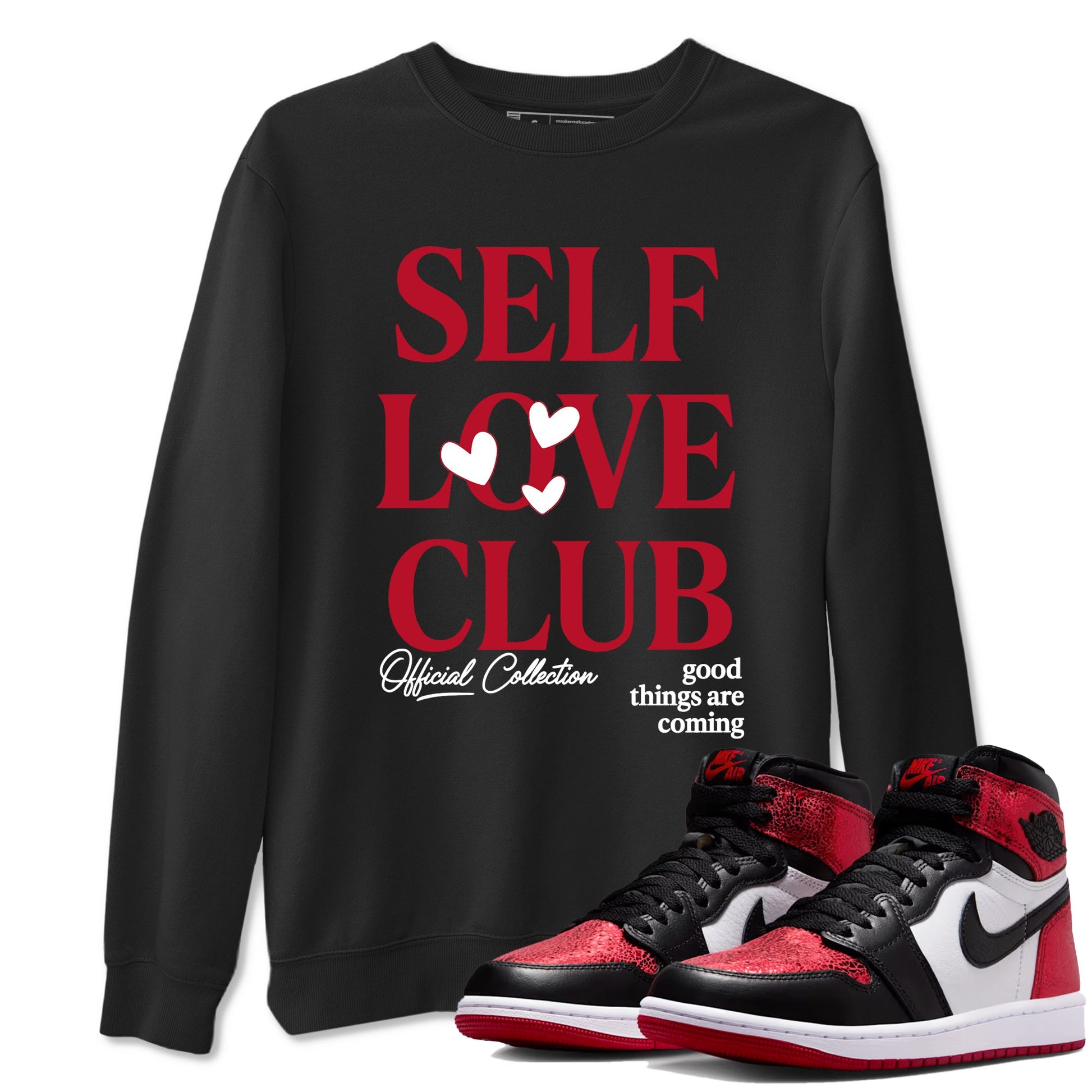 Self Love Club sneaker match t-shirt styled to complete your fit with the Air Jordan 1 Ruby sneakers, shown in Black 1.