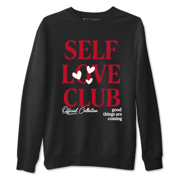 Self Love Club sneaker match t-shirt styled to complete your fit with the Air Jordan 1 Ruby sneakers, shown in Black 2.