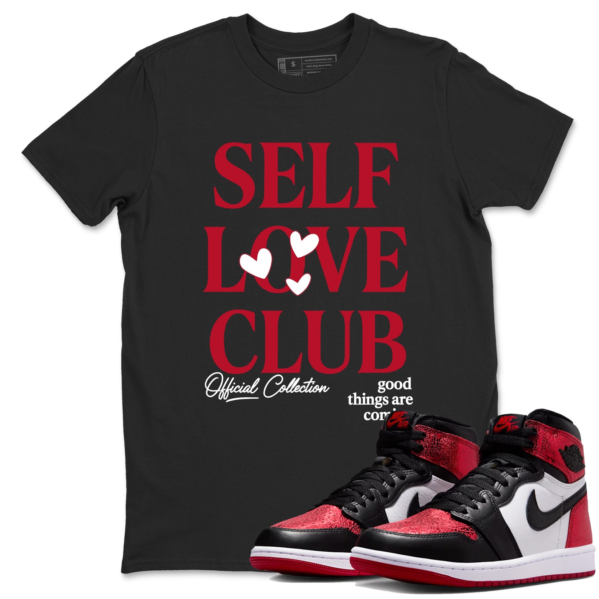 Self Love Club sneaker match t-shirt styled to complete your fit with the Air Jordan 1 Ruby sneakers, shown in Black 1.