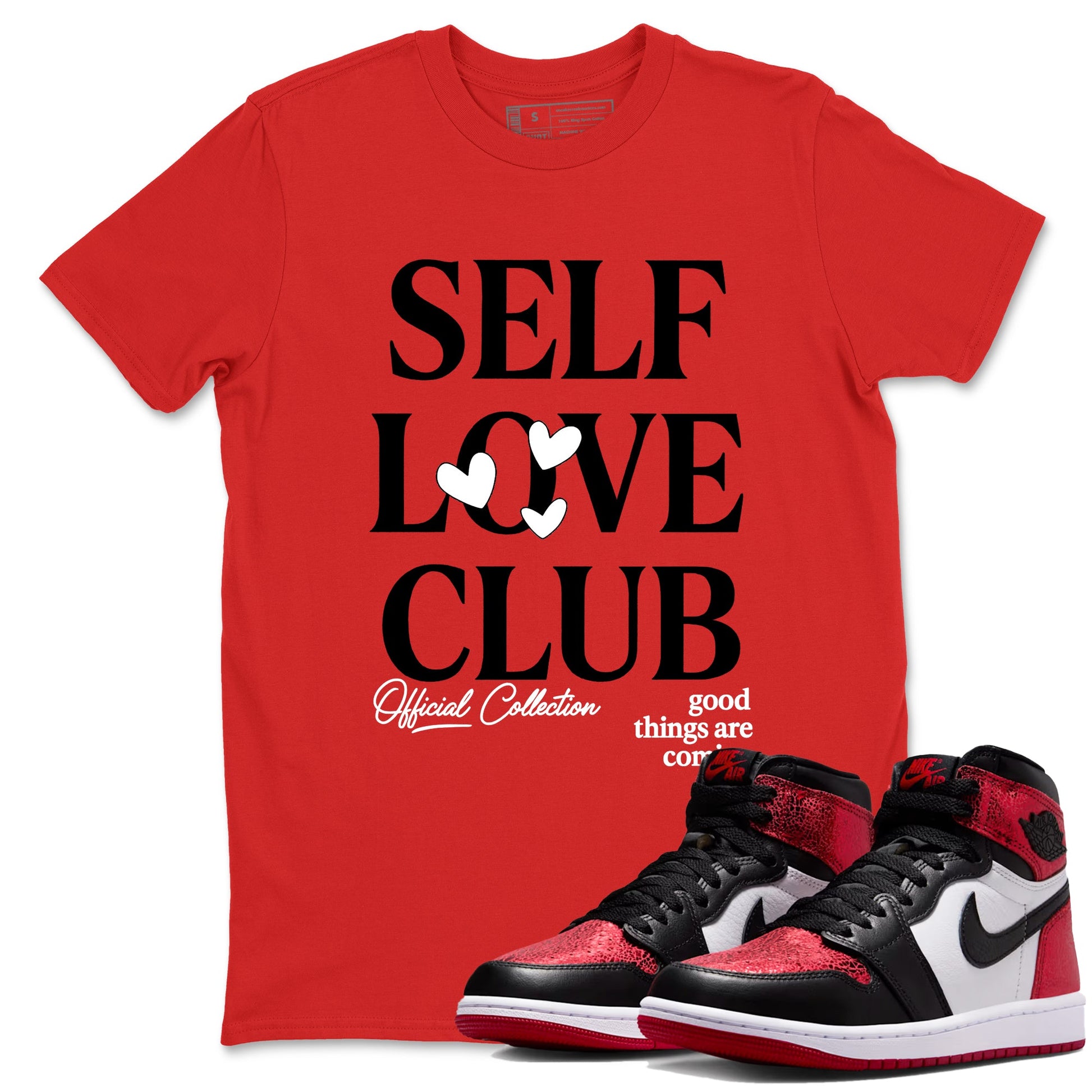 Self Love Club sneaker match t-shirt styled to complete your fit with the Air Jordan 1 Ruby sneakers, shown in Red 1.