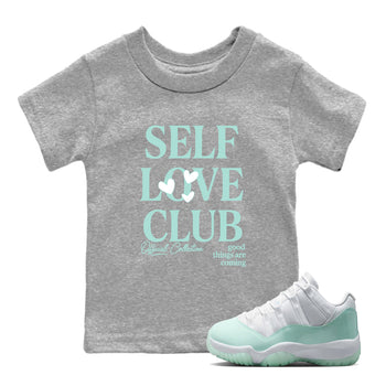 Self Love Club baby and kids t-shirt crafted for little sneakerheads to shine with the Air Jordan 11 Igloo sneakers, displayed in Heather Grey 1.