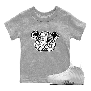 Sneaker Bear Face baby and kids t-shirt crafted for little sneakerheads to shine with the Air Foamposite One Triple White sneakers, displayed in Heather Grey 1.