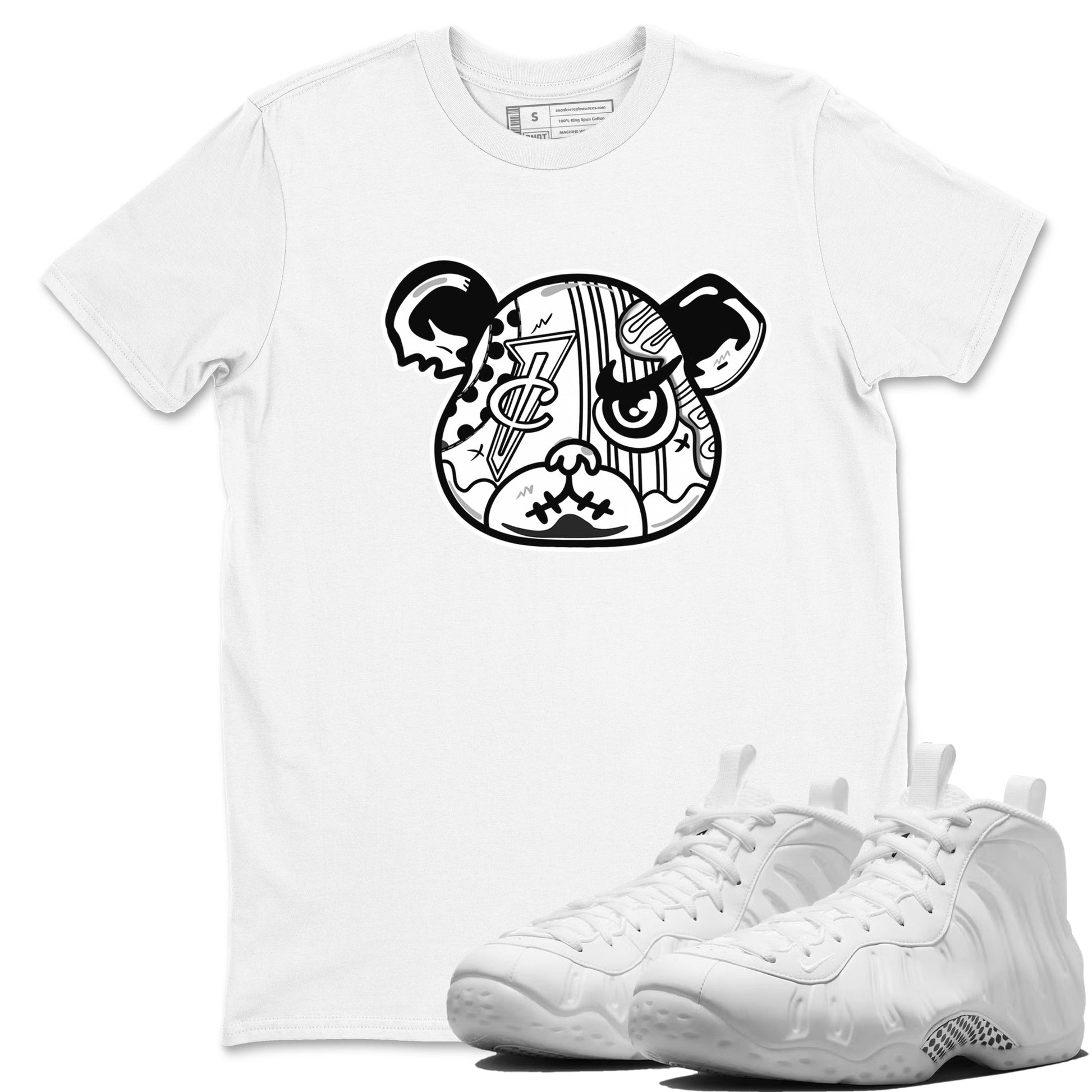 Sneaker Bear Face sneaker match t-shirt styled to complete your fit with the Air Foamposite One Triple White sneakers, shown in White 1.