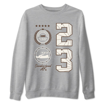 AJ12 Baroque Brown shirts to match jordans Sneaker Emblem best t shirts to wear with jordans SoleFly x Jordan 12 Baroque Brown match shoes to clothes SNRT Sneaker Tees unisex cotton Heather Grey 2 shirts