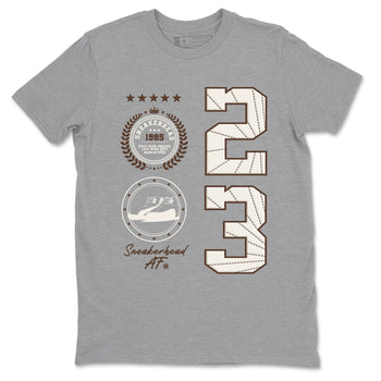AJ12 Baroque Brown shirts to match jordans Sneaker Emblem best t shirts to wear with jordans SoleFly x Jordan 12 Baroque Brown match shoes to clothes SNRT Sneaker Tees unisex cotton Heather Grey 2 shirts