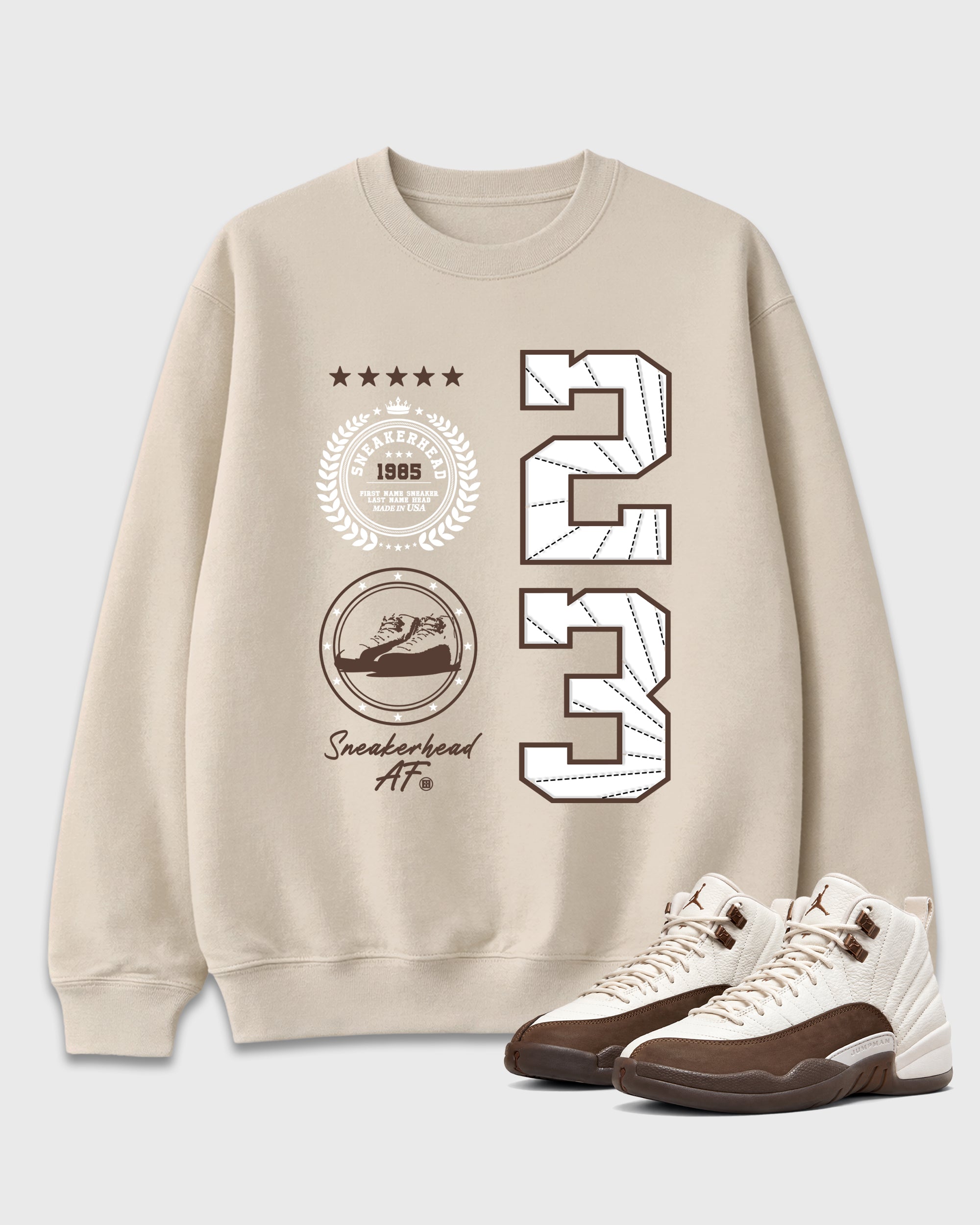 Sneaker Emblem Graphic T-Shirt featuring original streetwear artwork designed to match the Air Jordan 12 Fireside. Natural 1 Graphic Tee.