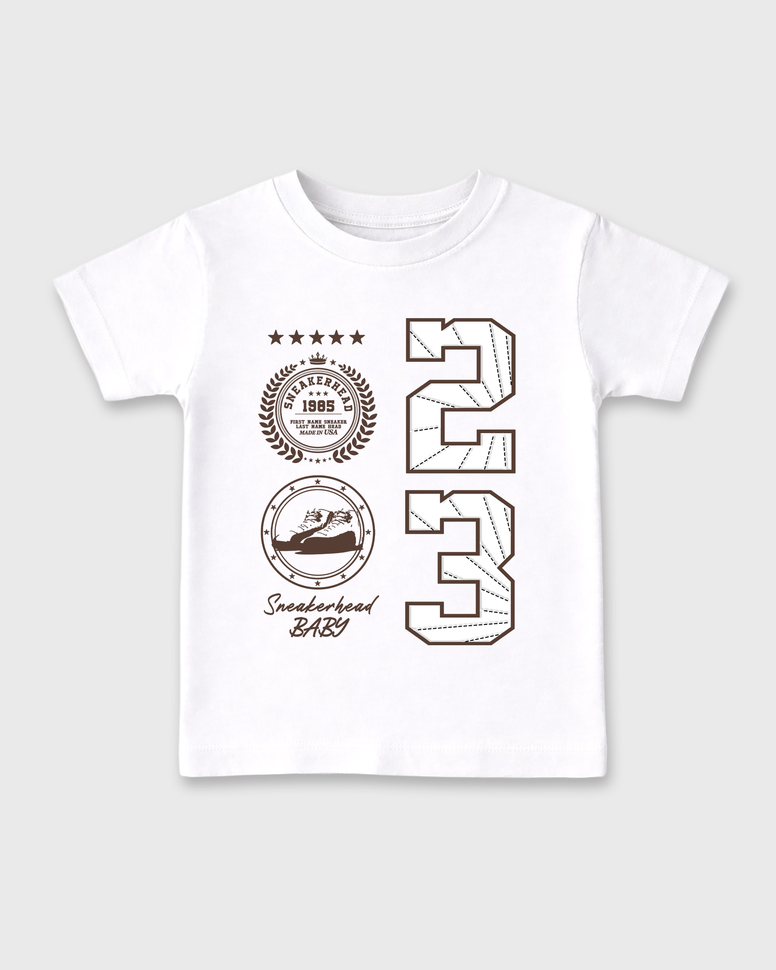 Sneaker Emblem Baby & Kids Graphic T-Shirt featuring original artwork designed to match the Air Jordan 12 Fireside. White 2 Kids Graphic Tee.