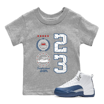 Sneaker Emblem baby and kids t-shirt crafted for little sneakerheads to shine with the Air Jordan 12 French Blue sneakers, displayed in Heather Grey 1.